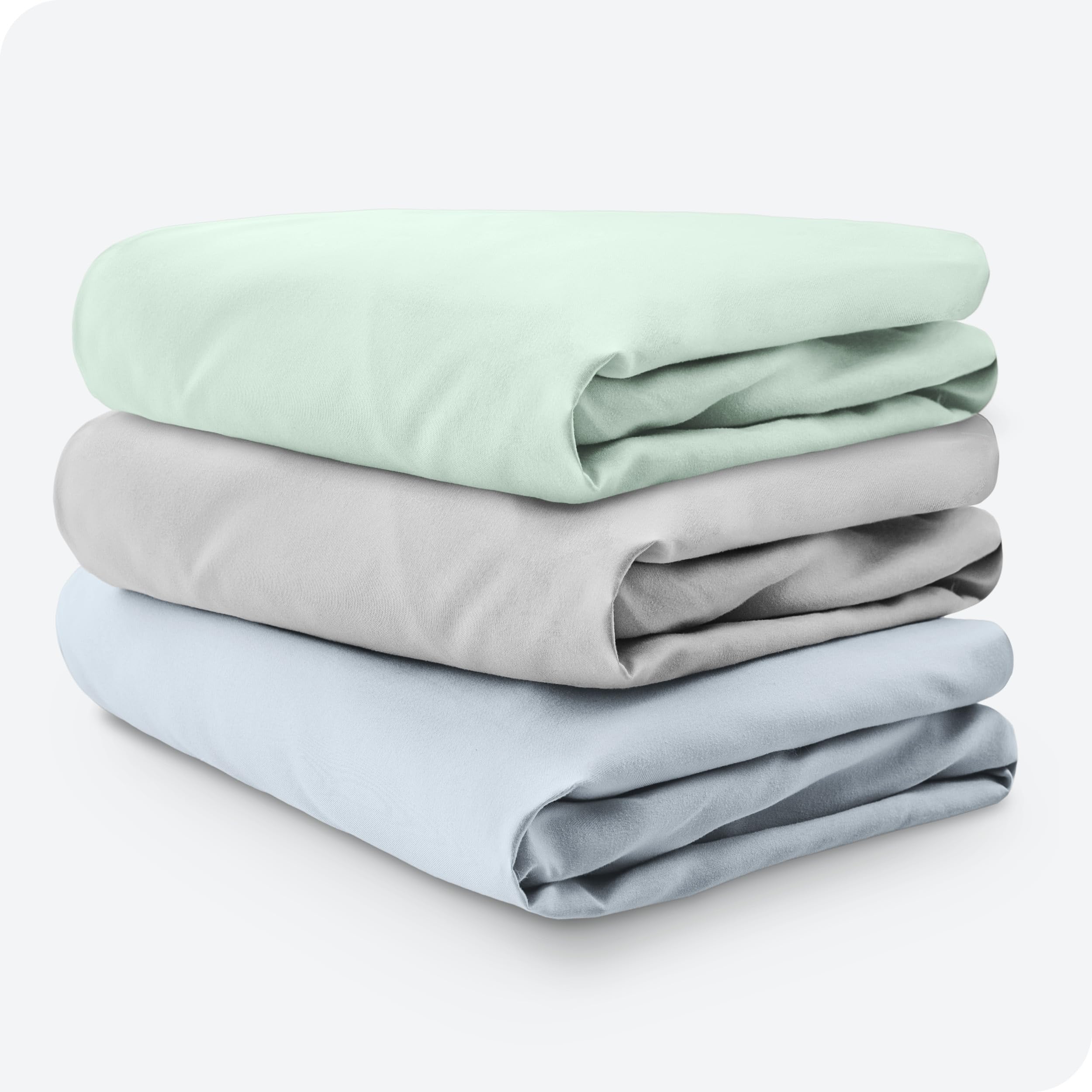 Bare Home packaging and three-sheet set arranged for nursery setup.