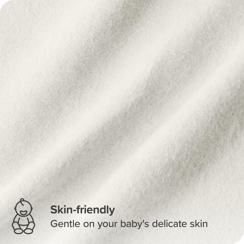Bare Home receiving blanket cream spread over changing station for quick swaddling moments