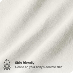 Bare Home receiving blanket cream spread over changing station for quick swaddling moments