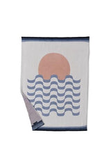 Care-ready Barefoot Dreams CozyChic blanket highlighting machine washability and easy care.