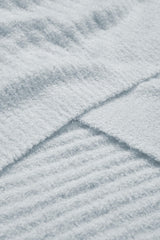 Barefoot Dreams CozyChic Lite blanket in blue for bedtime snuggle and reading