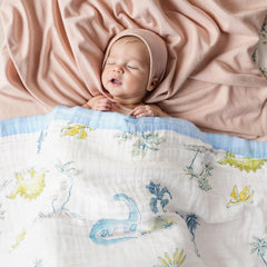 Battilo Pty dinosaur blanket as stroller cover for shade and gentle warmth.
