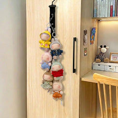 Bawiked display closeup of clips securing tiny plush toys.