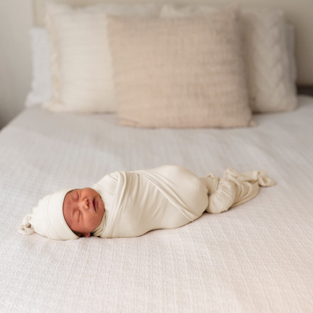 Bayceen swaddle with hat natural set demonstrates complete newborn swaddle and headwear for cozy mornings.