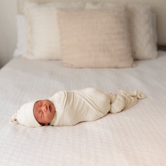 Bayceen swaddle with hat natural set demonstrates complete newborn swaddle and headwear for cozy mornings.