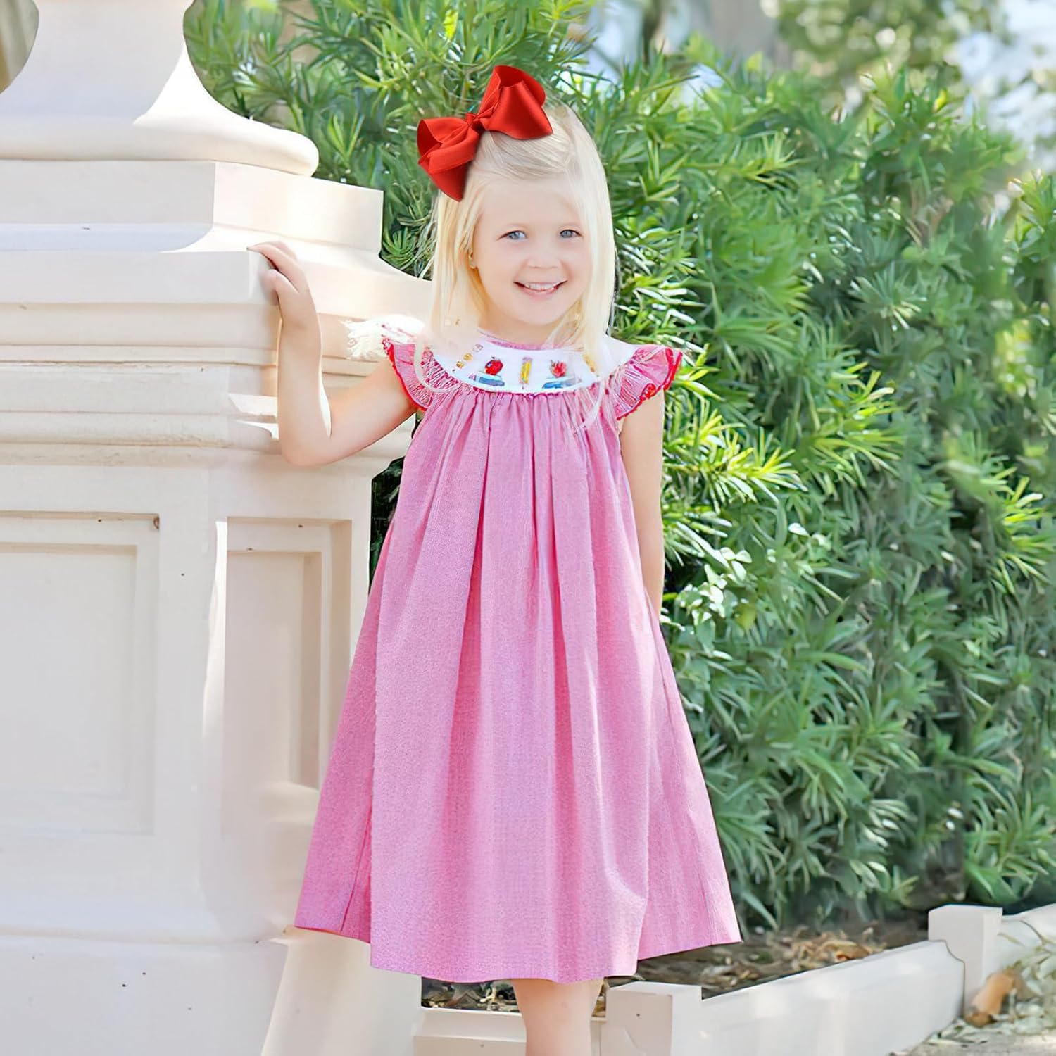 BBGifts two red bows on a baby’s hair demonstrate versatile style