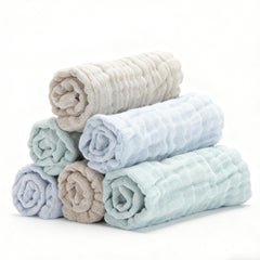 Bear Rocket organic muslin washcloths blue folded for gentle baby cleansing.