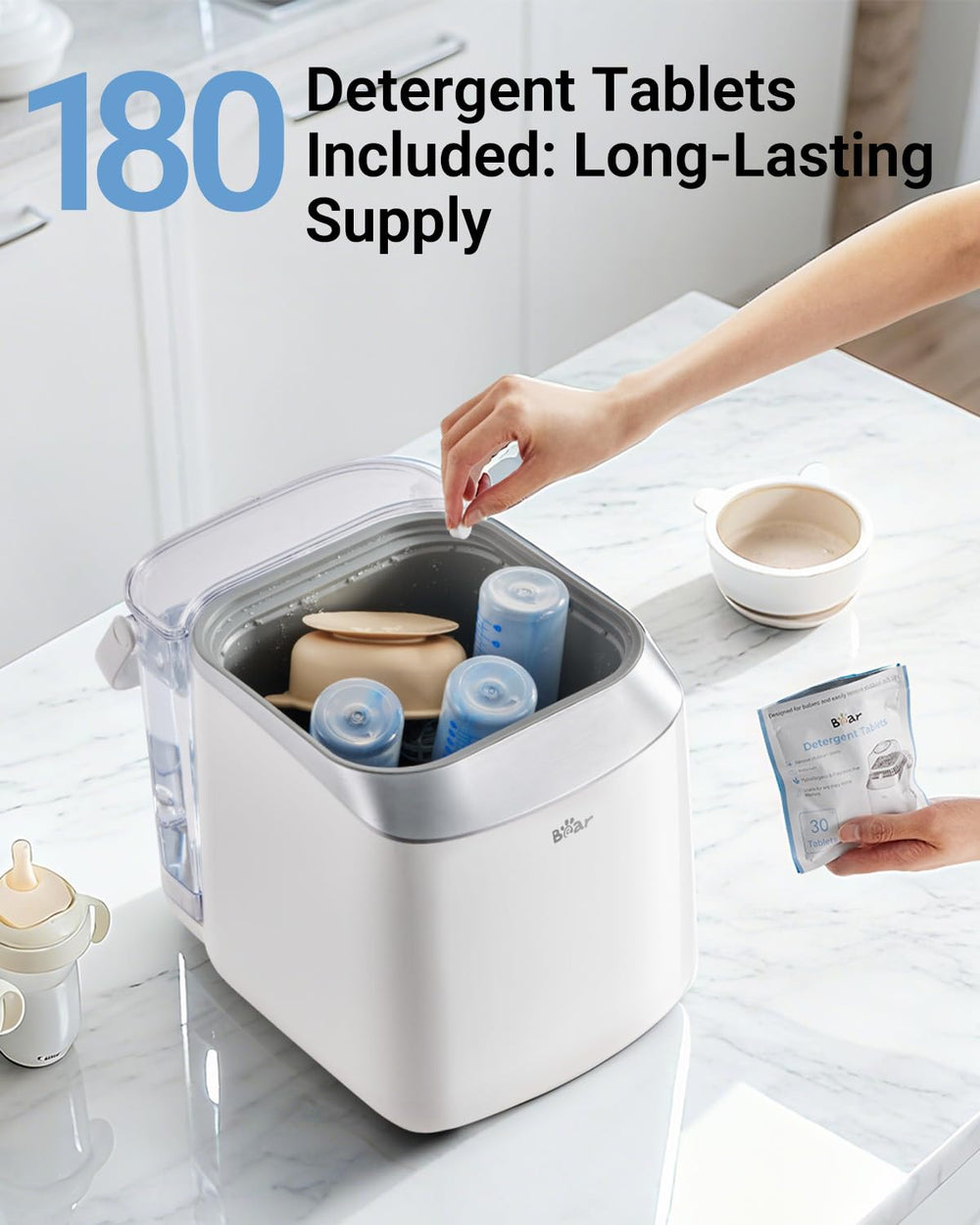 Bear tablets removing tough milk residue during a wash.