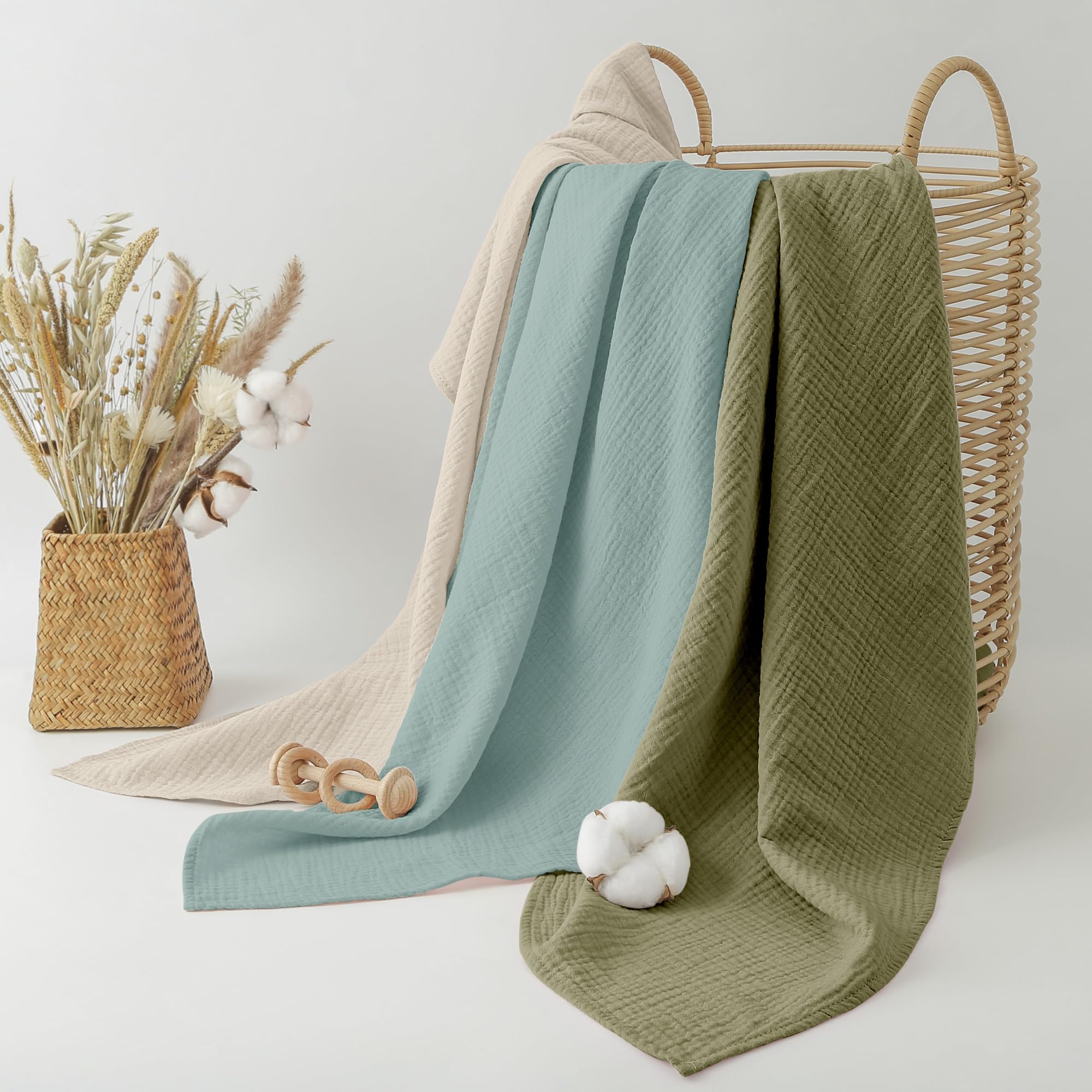 Bearmoss muslin swaddle blanket grey-green used as nursing cover.
