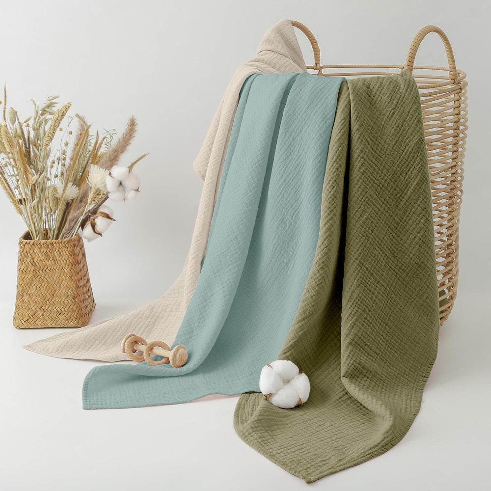 Bearmoss muslin swaddle blanket grey-green used as nursing cover.