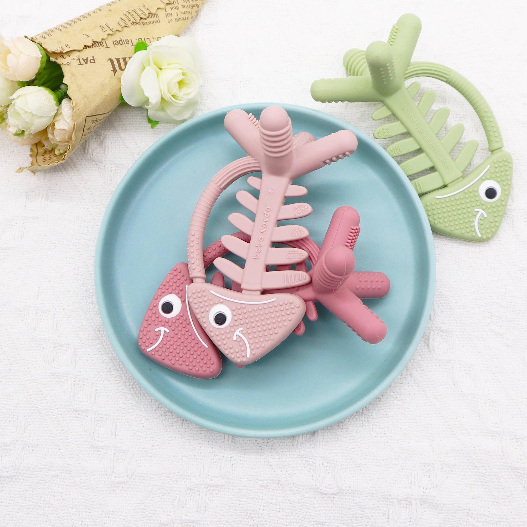 Compact, diaper-bag ready teether from Bebe Mondo for teething relief.