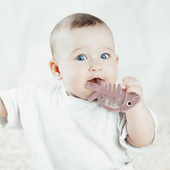 Bebe Mondo teether with textured fins side aids gum massage.
