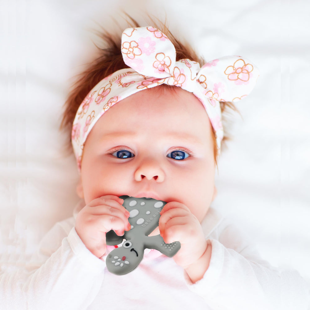 Bebe Mondo Dinosaur Teether Olive beads for sensory exploration.