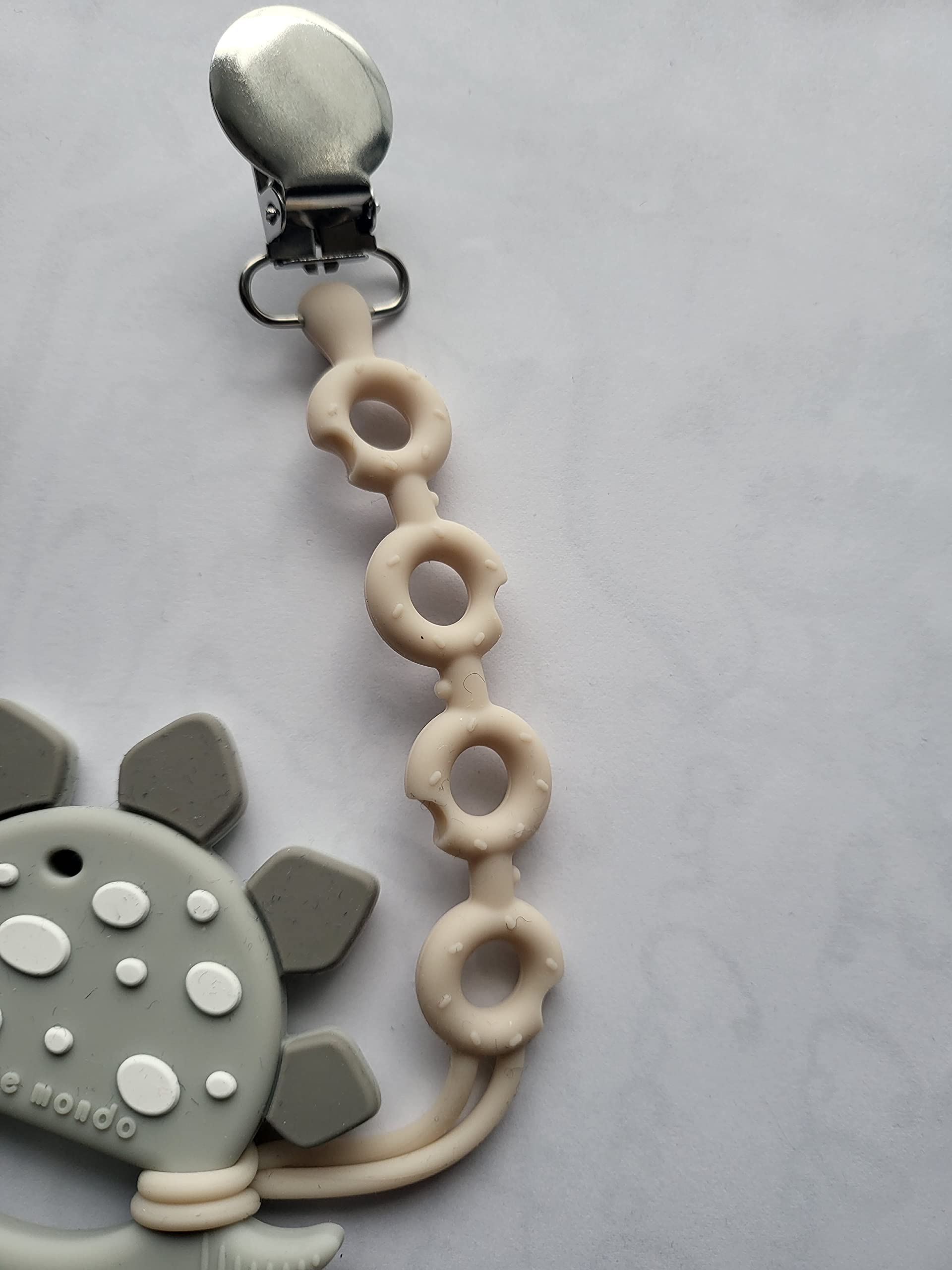Bebe Mondo dinosaur teether freezer-safe for soothing cold relief.
