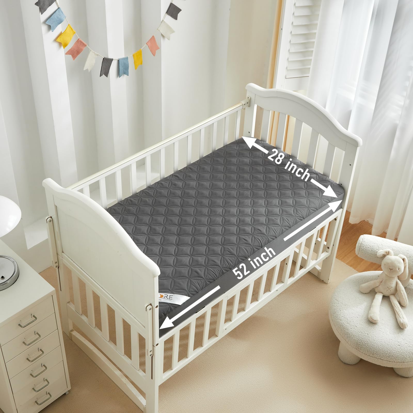 BEDLORE waterproof crib mattress protector close-up highlighting spill protection