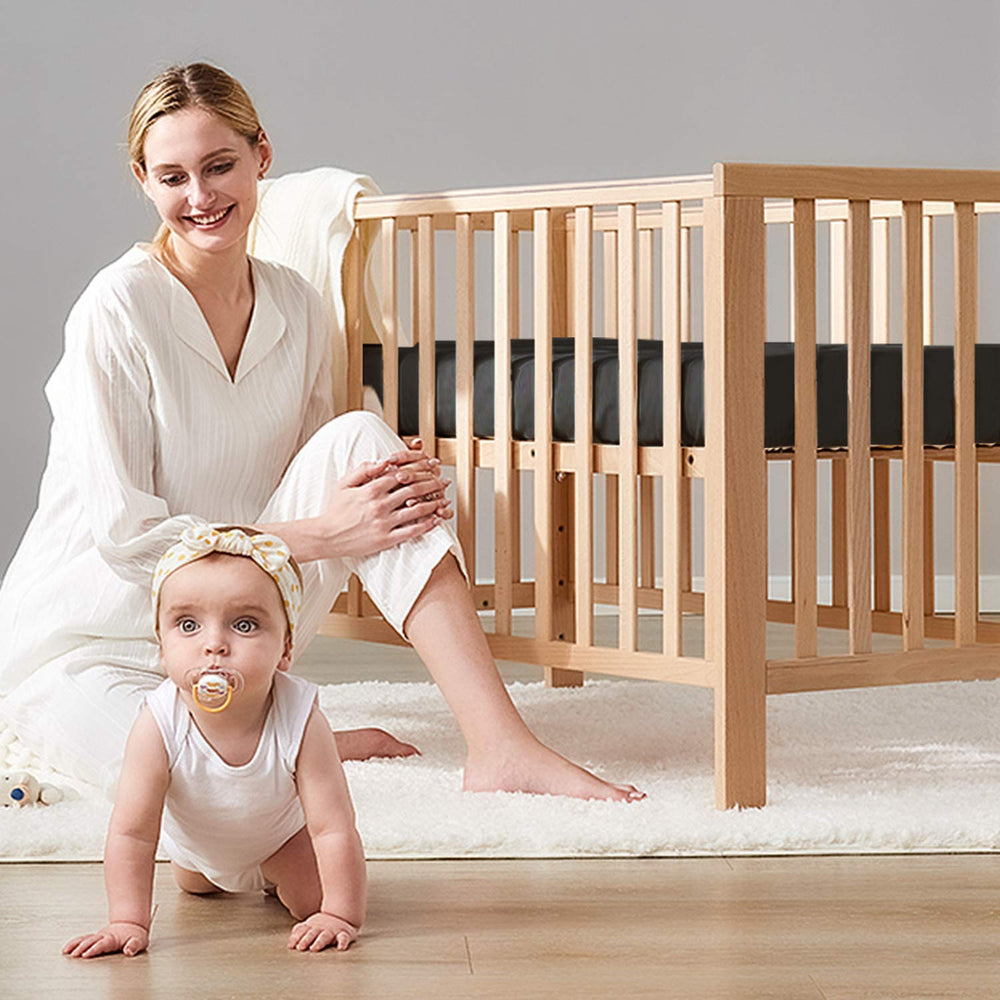 BEDSUM crib-fit sheet on standard mattress highlighting snug fit