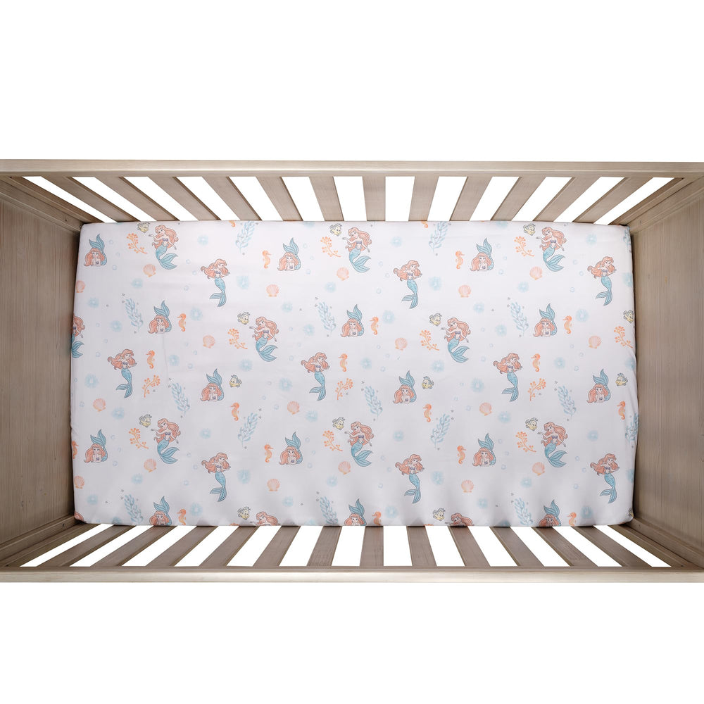 Bedtime Originals Ariel seashells bubbles print brightens the nursery ambiance.