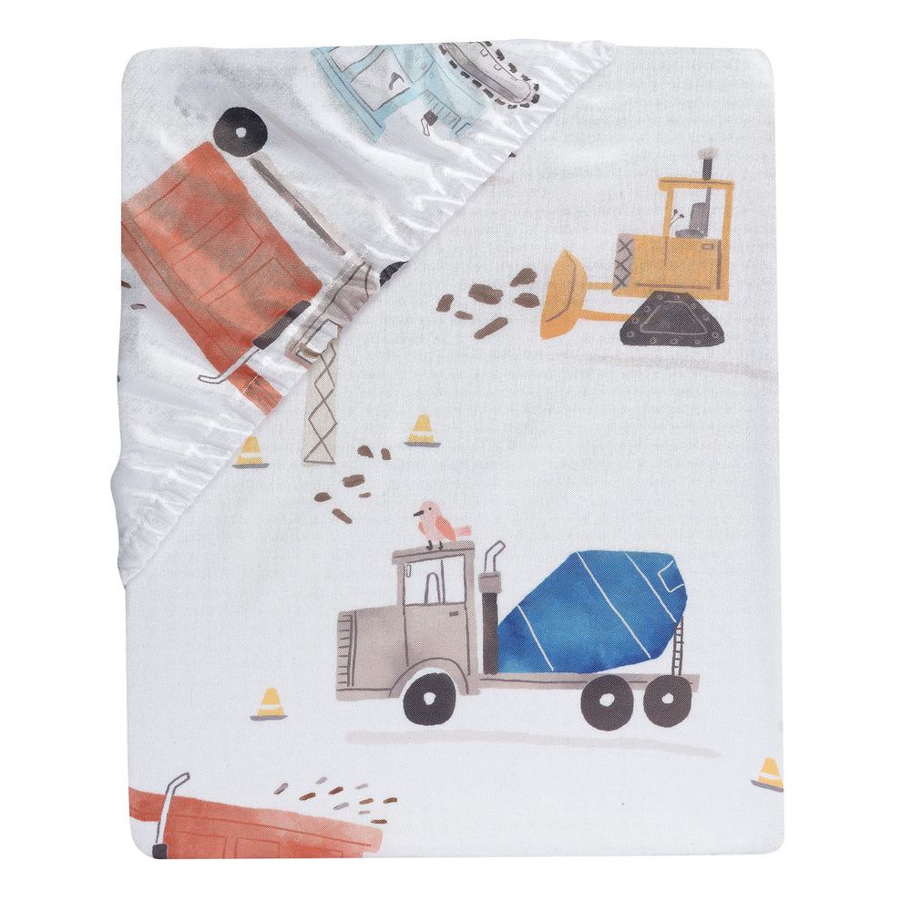 Bedtime Originals Construction Zone sheet shows cement trucks in a bright pattern
