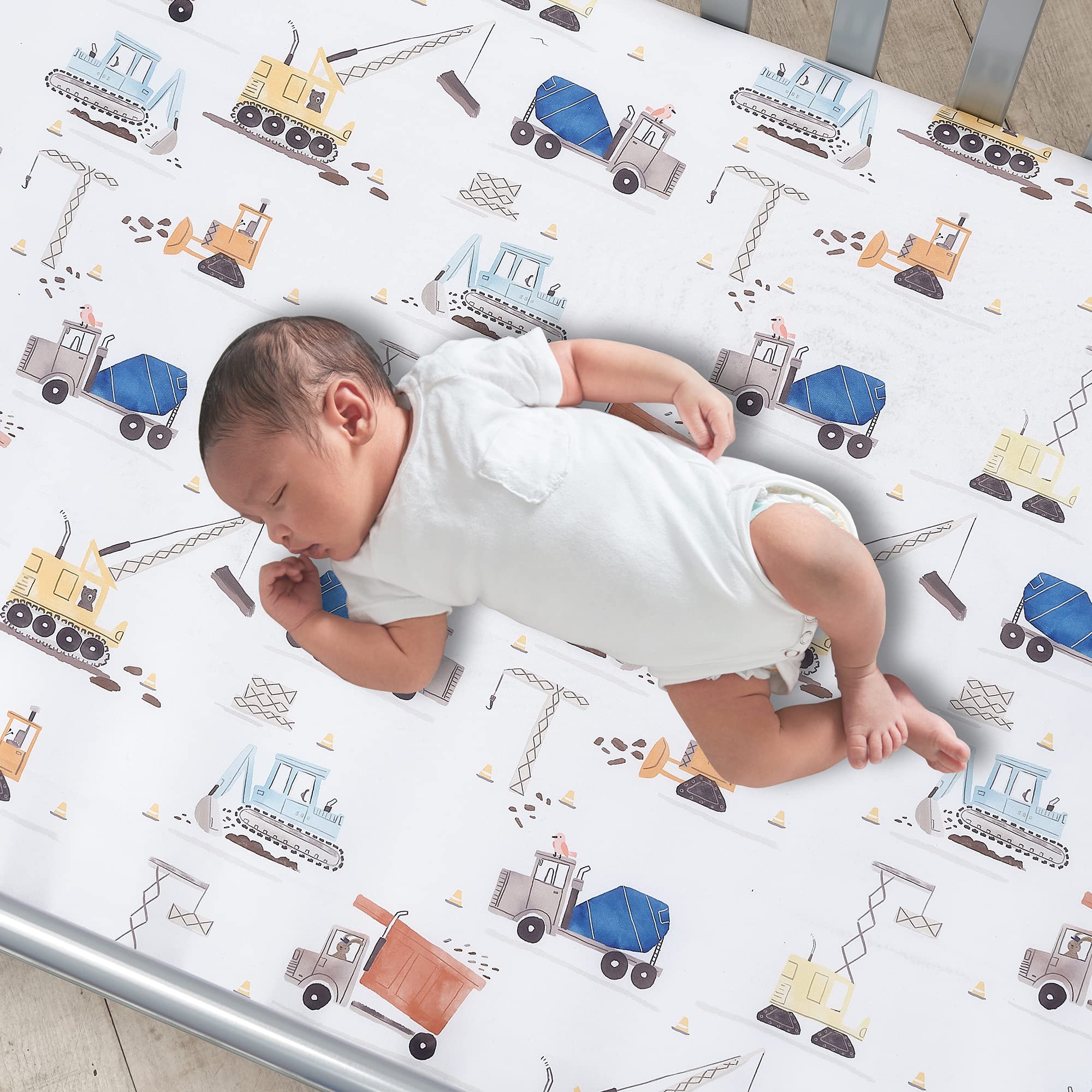 Bedtime Originals Construction Zone sheet featuring a dump truck design for imaginative play