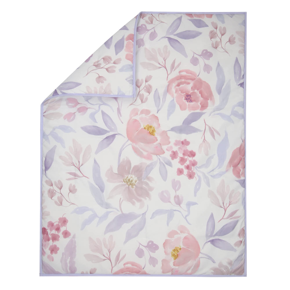 Bedtime Originals lavender floral nursery scene featuring coordinated bedding.