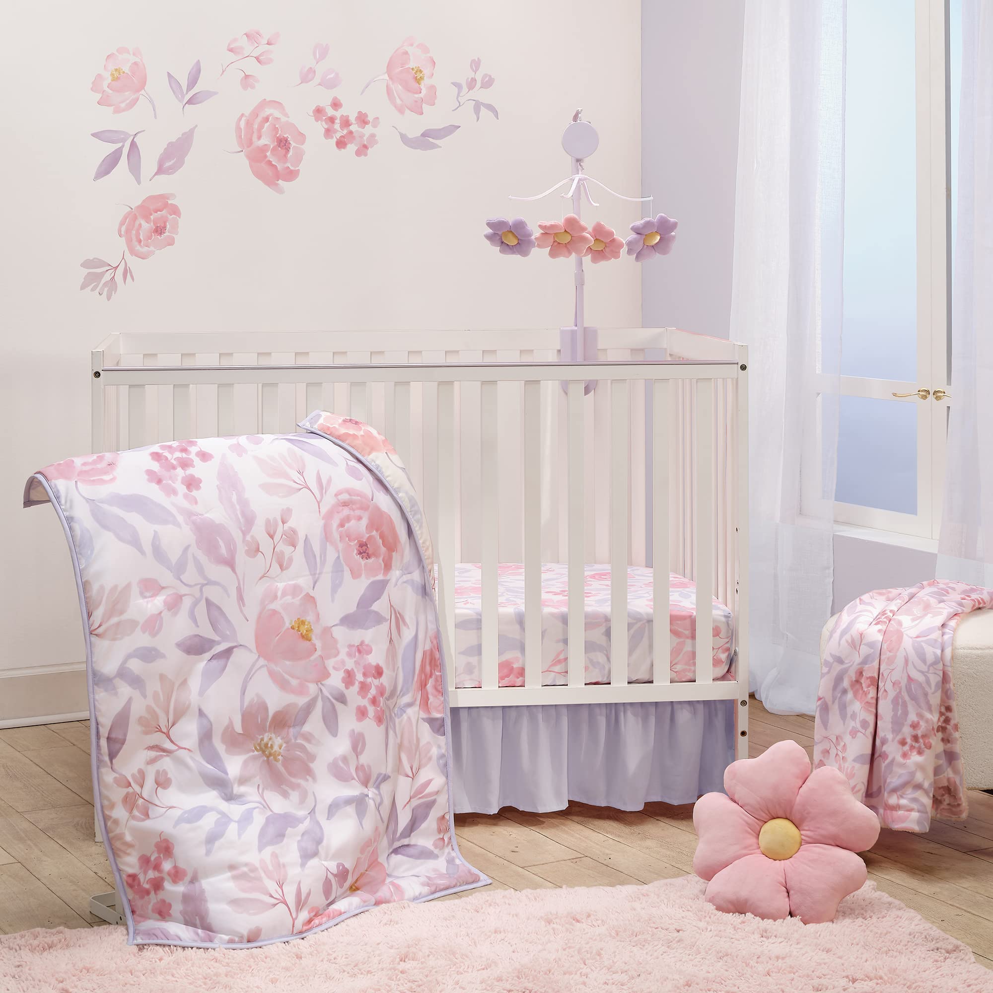 Bedtime Originals lavender floral quilt showing watercolor roses for a cozy nursery accent.
