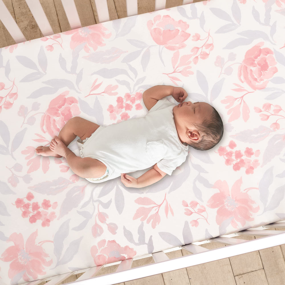Bedtime Originals lavender floral roses and peonies design on soft bedding.