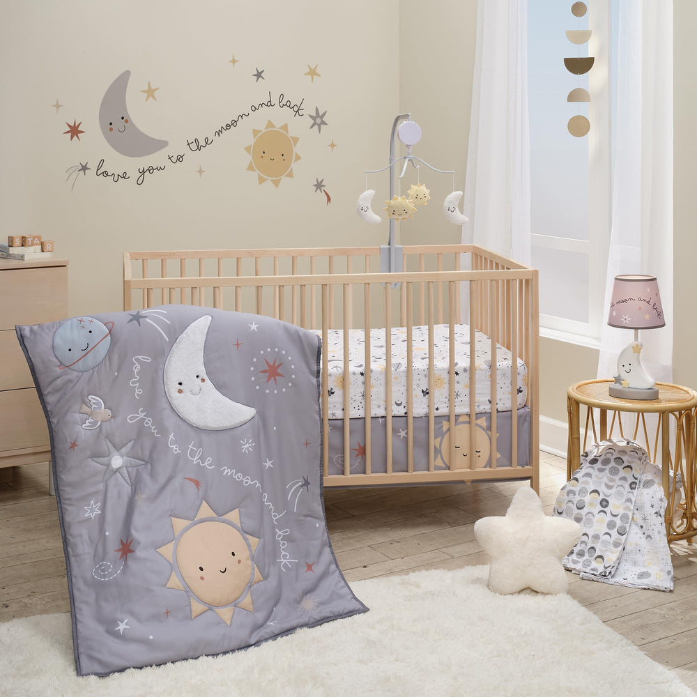 Bedtime Originals Little Star Celestial quilt with moon appliqué for cozy nursery décor.