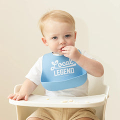 Bella Tunno bib showing deep pocket catching crumbs during feeding