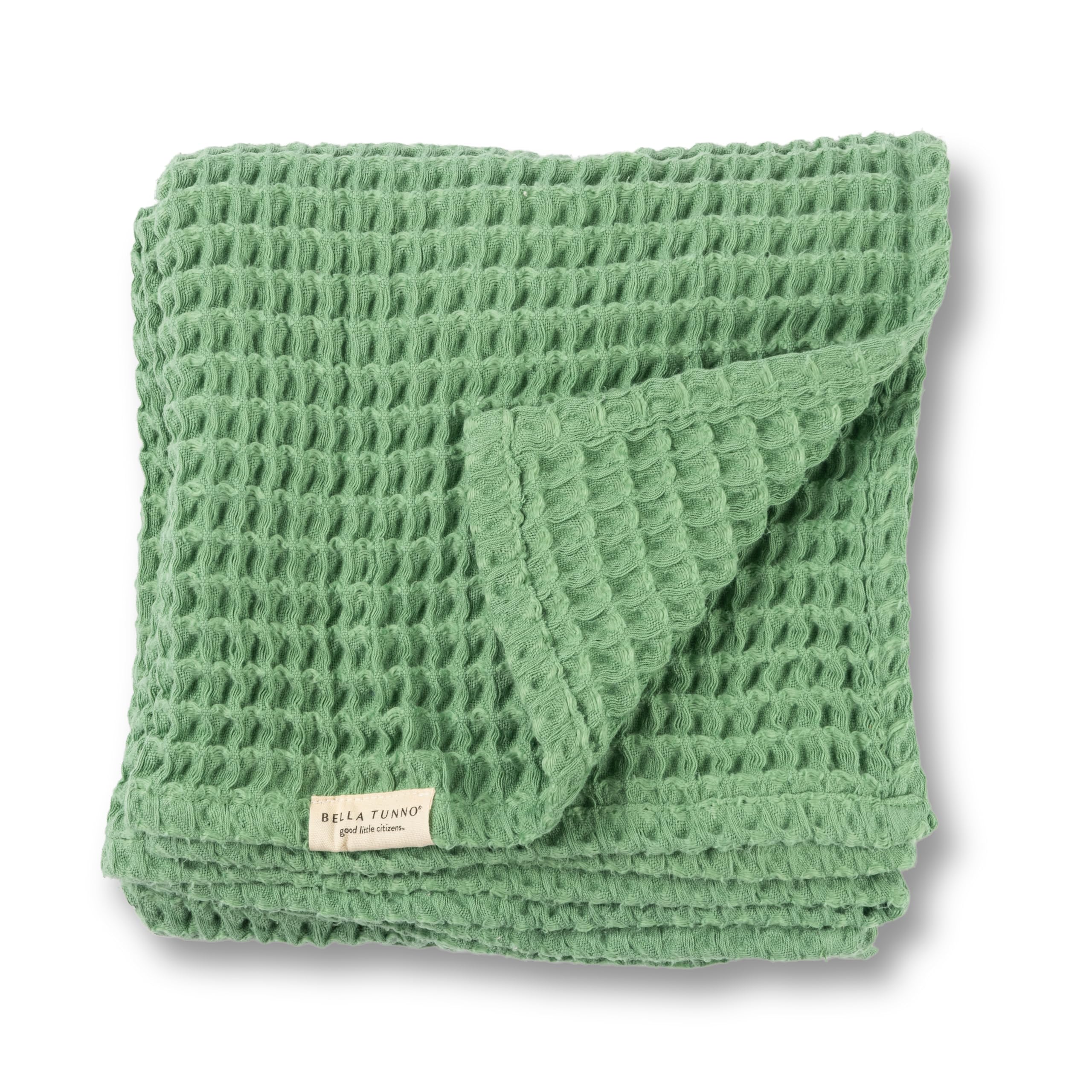 Bella Tunno waffle baby blanket in sea foam, neatly folded for cozy nursery décor.