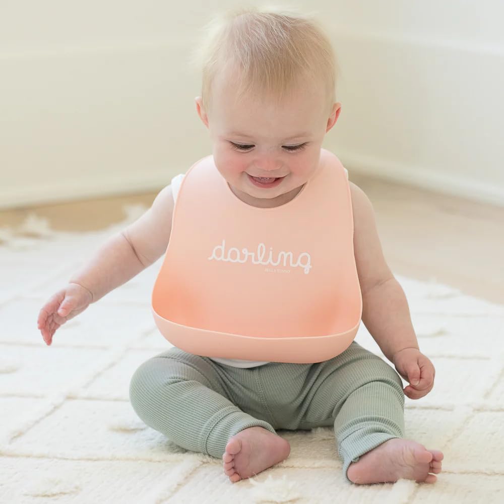 Bella Tunno Wonder Bib with two-snap neck grows with baby from 4 to 12 months.
