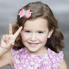 BESALECK alligator clip hair bow securely anchors a chic style.