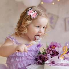 Besaleck cow print bow with white number clip for photo-ready party looks.