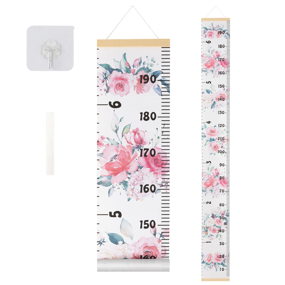BESSLEE canvas growth chart on wall with pink flowers design for a kid’s room.