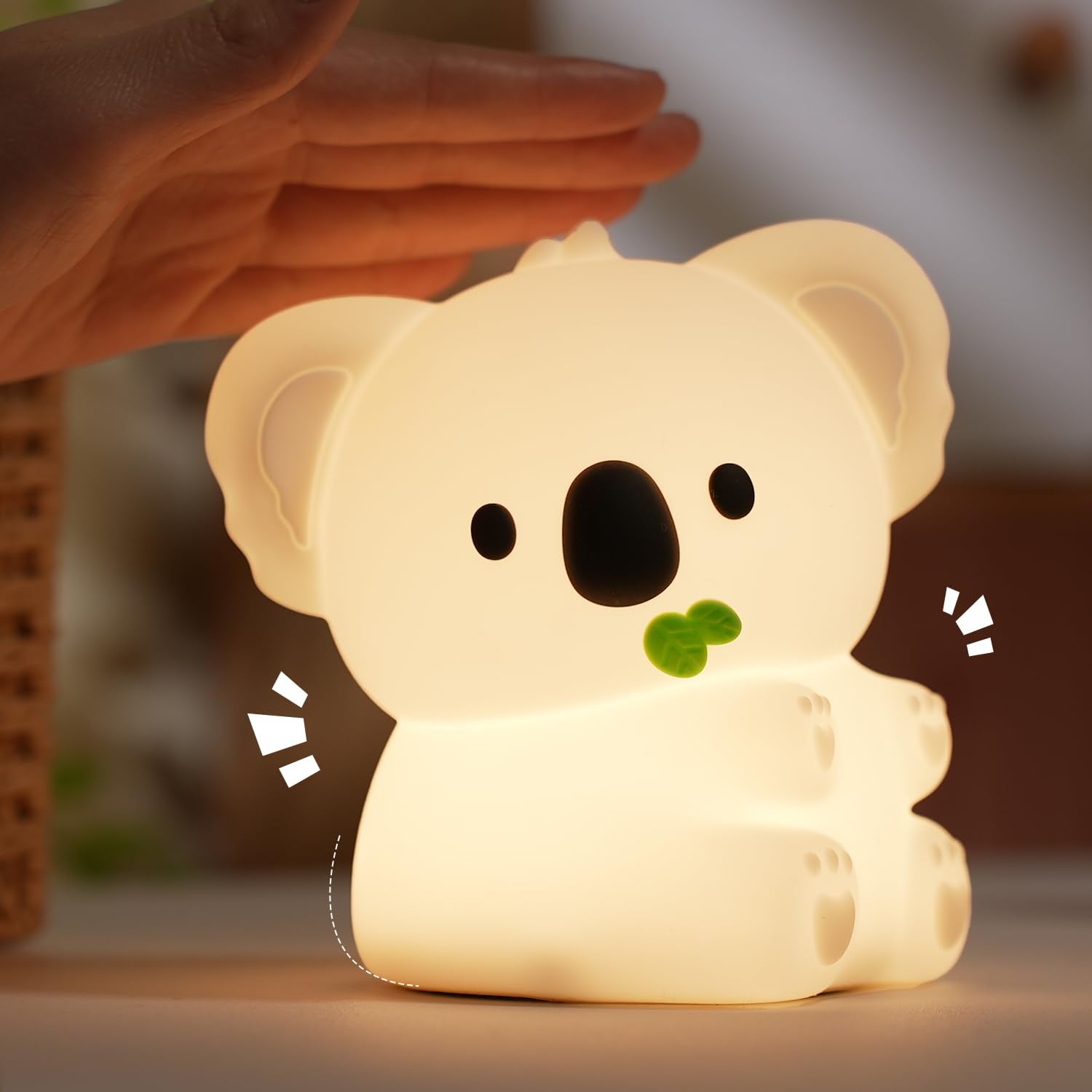 Bestfaith Koala night light on bedside table emits a warm, cozy glow.