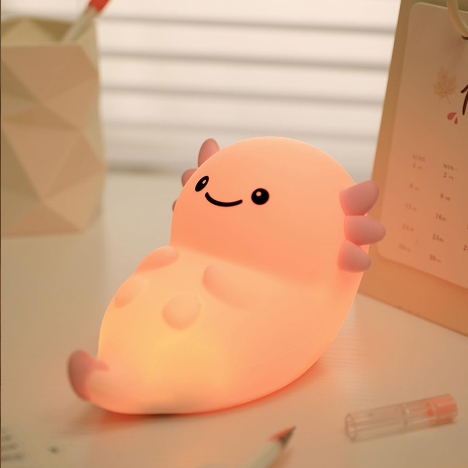Bestfaith pink axolotl night light on table with soft bedtime glow