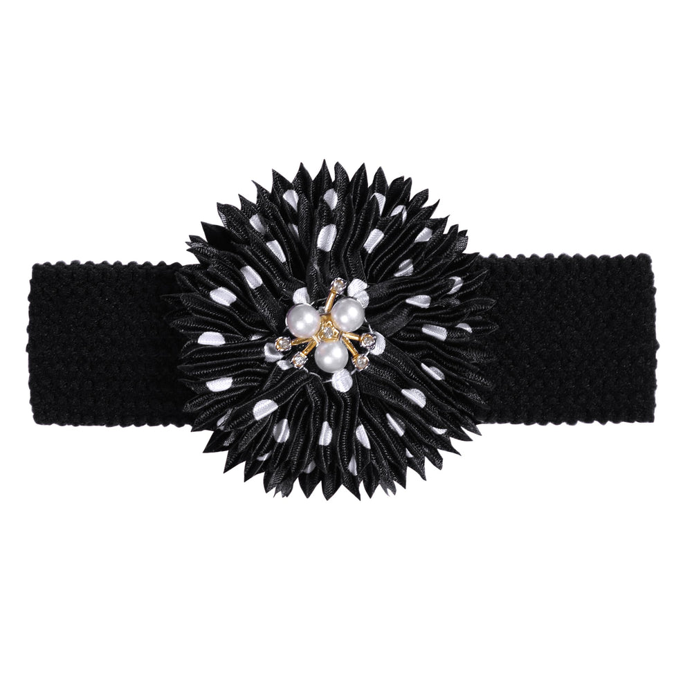 BESZANA black flower headband adds contrast and keeps style intact.