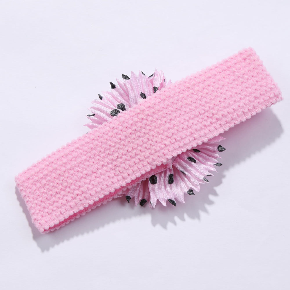 BESZANA headband close-up shows flower embellishment with delicate detailing.