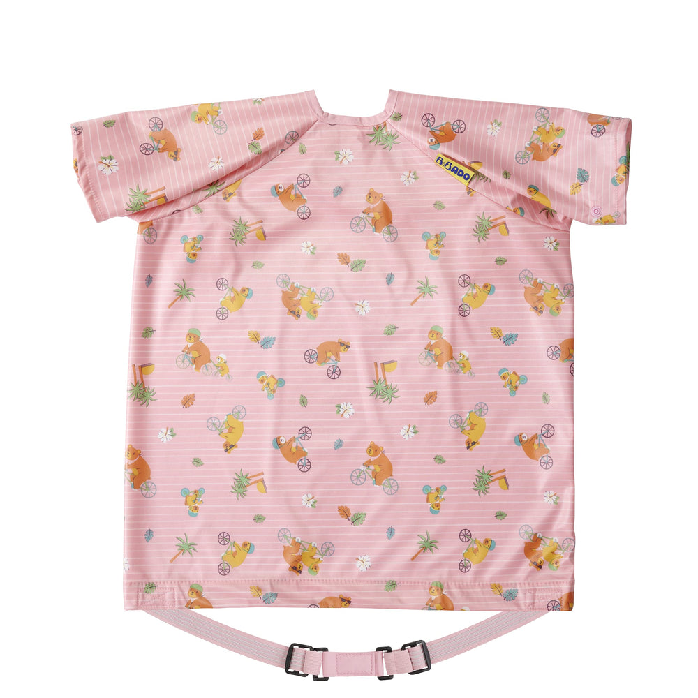 BIBaDO coverall bib on a highchair tray keeps meals mess-free.