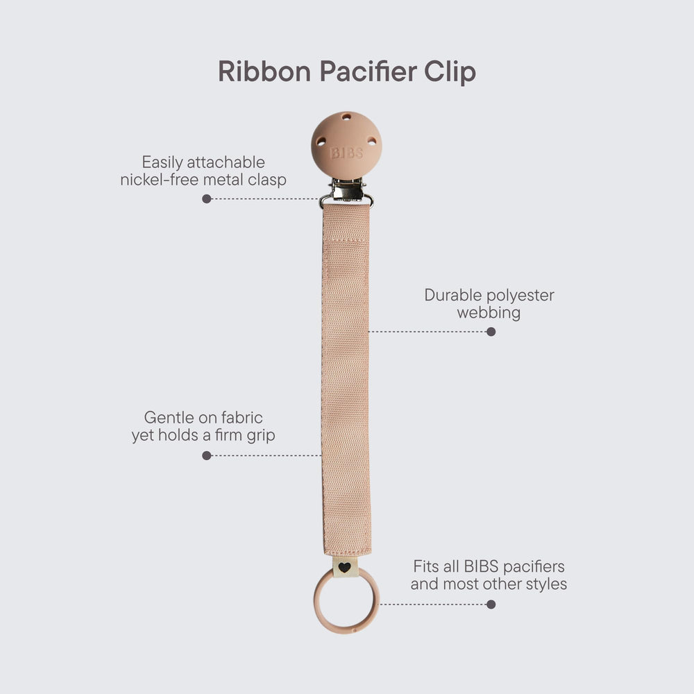 BIBS pacifier clip ribbon blush metal clip closeup highlights nickel-free safety for daily use