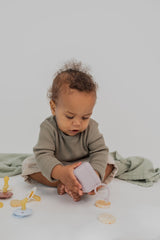 BIBS travel-friendly pacifier box shown on the go.