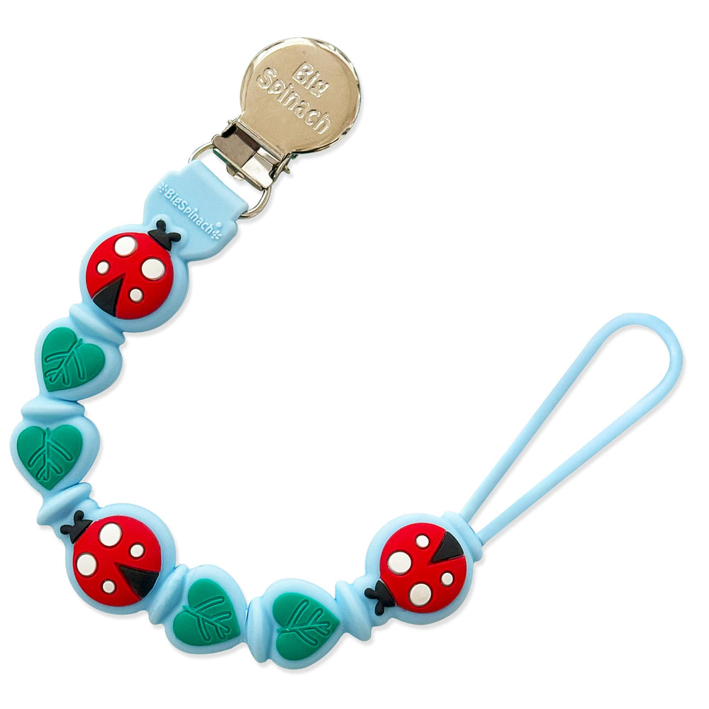 BigSpinach silicone pacifier clip blue closeup with a secure grip.