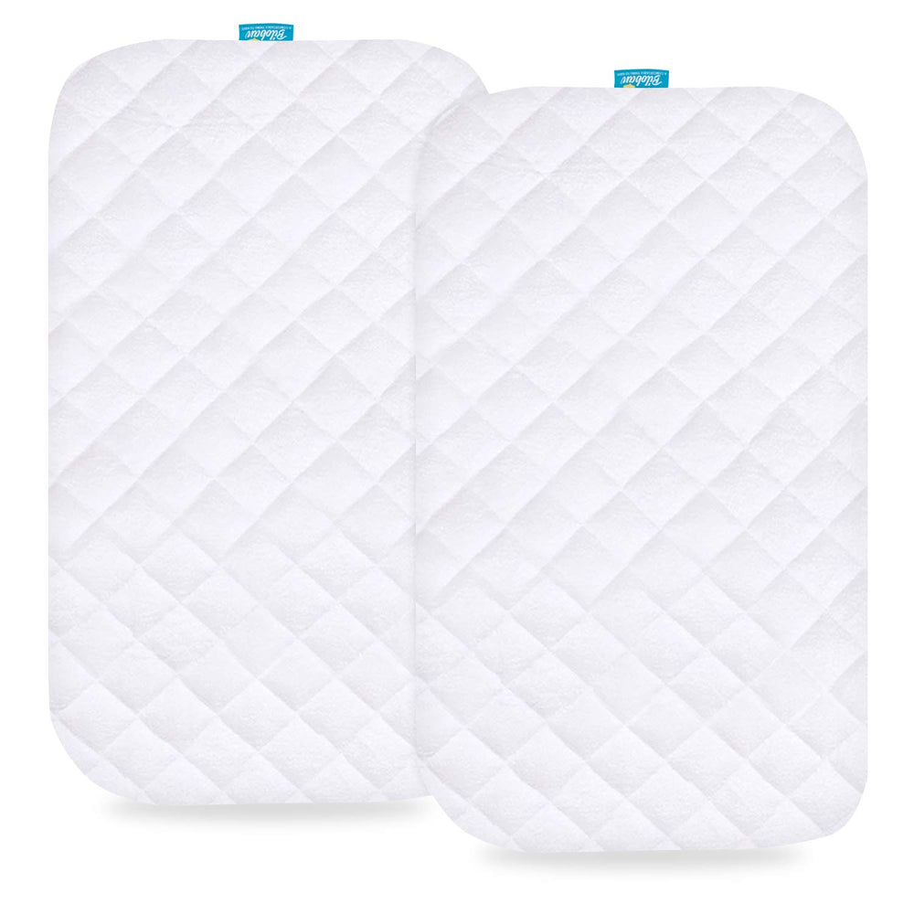 Biloban bassinet mattress pad cover shown on a bedside crib, waterproof protection for spills