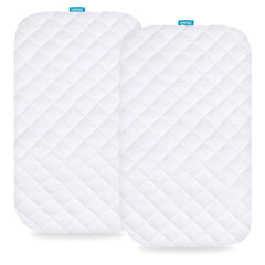 Biloban bassinet mattress pad cover shown on a bedside crib, waterproof protection for spills