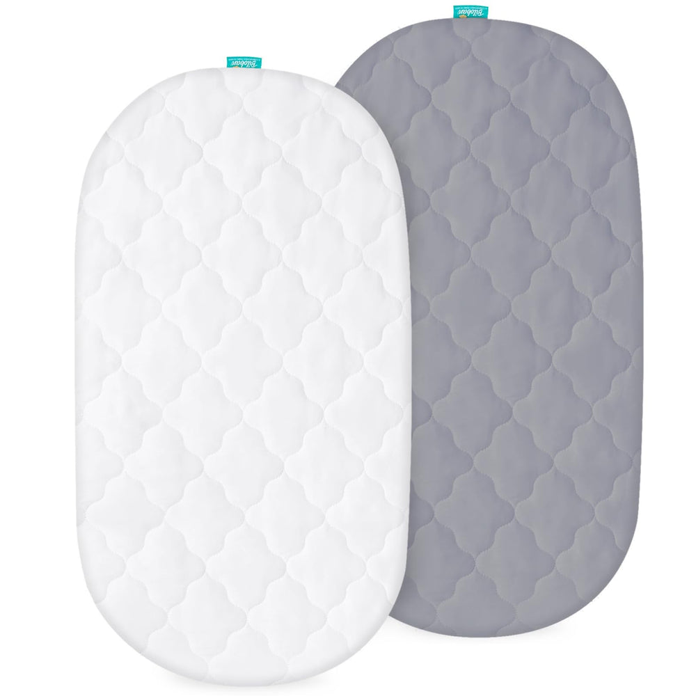 Biloban bassinet pad cover with elastic-edge for secure fit and quick changes.