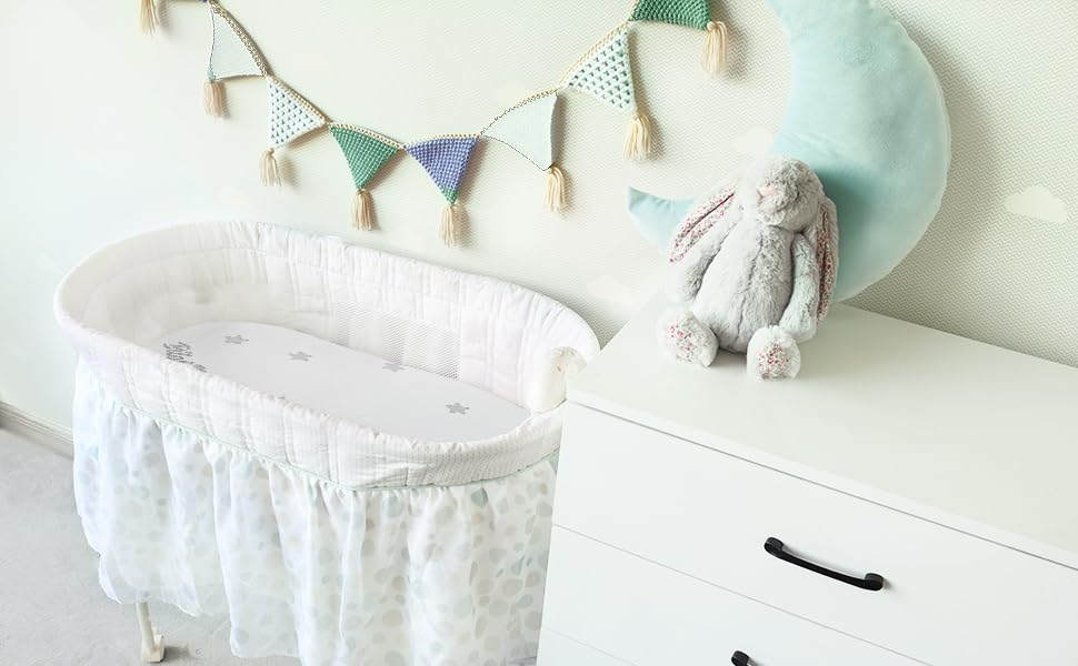 Lifestyle shot of Biloban pad in a MamaRoo Sleep bassinet with baby.