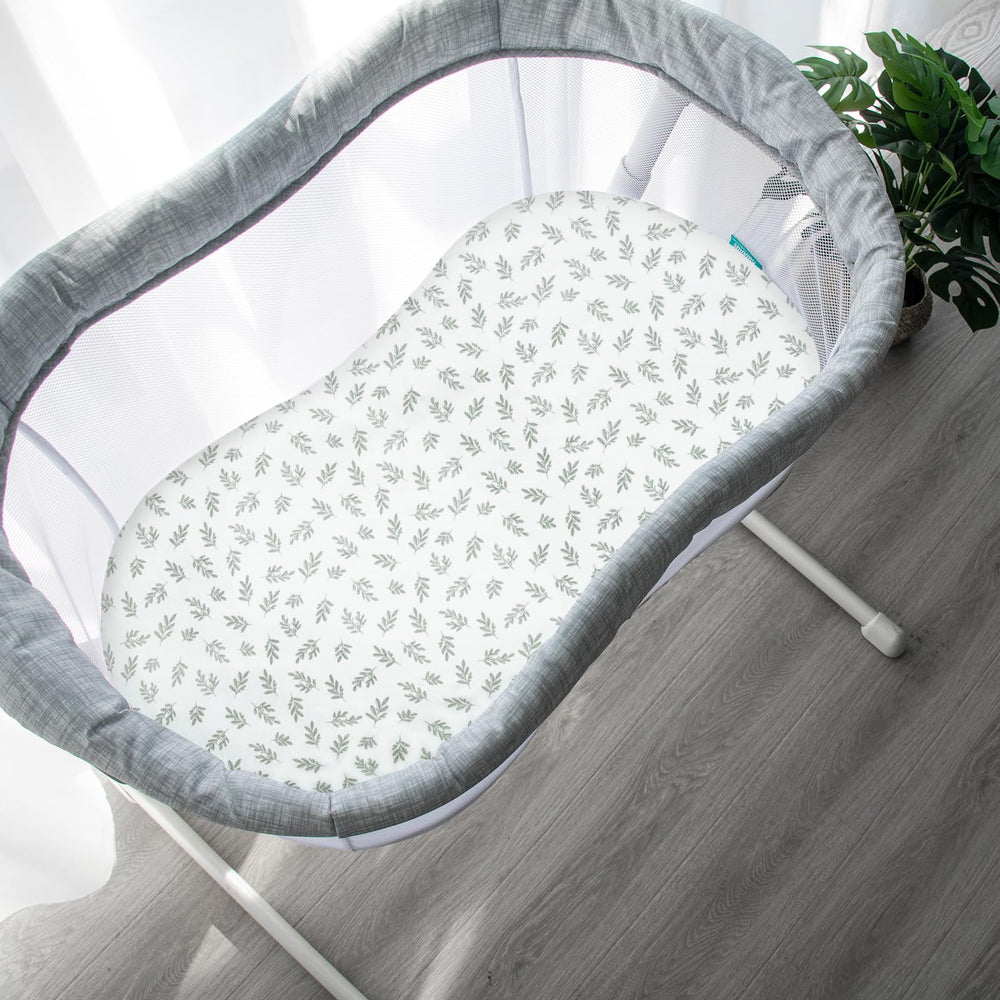 Four-pack Biloban sheets with neutral prints for versatile nursery styling.