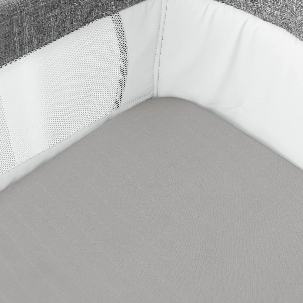 Biloban bassinet sheets in use on a rectangular mattress.