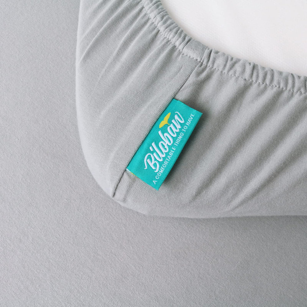 Machine-washable Biloban bassinet sheets with easy-care iconography.