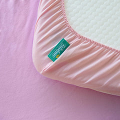 Biloban bassinet-sheets-ultra-soft-cotton offer a gentle touch for baby's comfort.