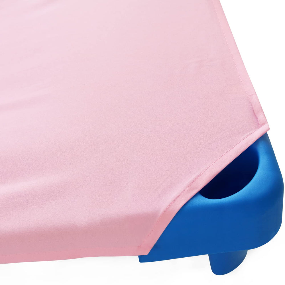 Biloban cot sheet on pink fabric shows machine-washable convenience for busy classrooms.